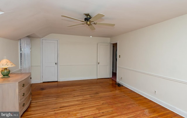 unfurnished bedroom with ceiling fan and light hardwood / wood-style flooring