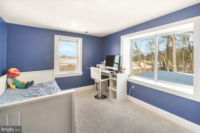 bedroom with light colored carpet