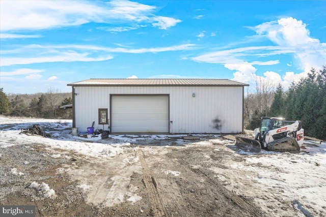 view of snow covered garage