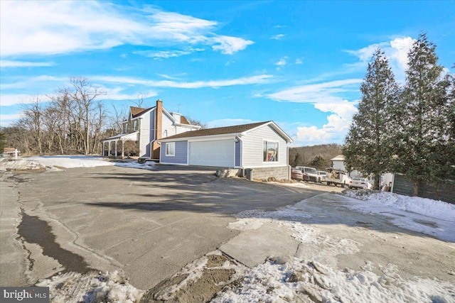 view of property exterior featuring a garage