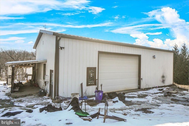 view of snow covered garage