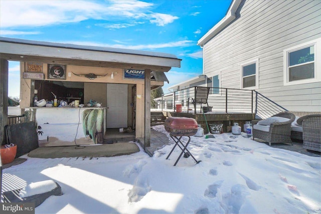 view of snow covered property entrance