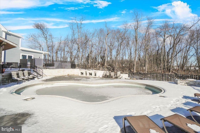 view of snow covered pool