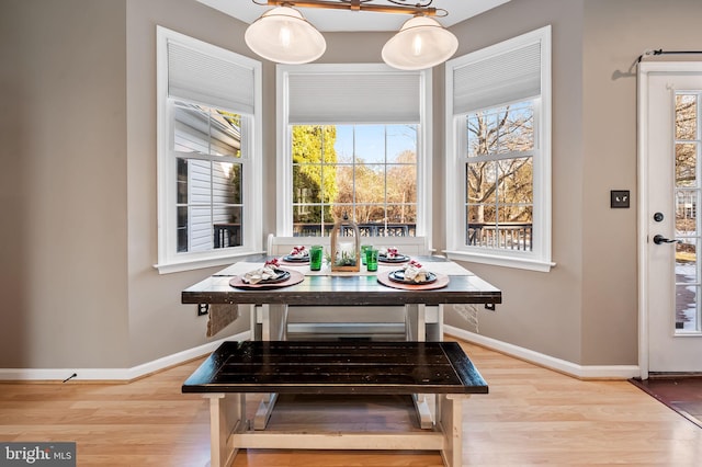 dining space featuring light wood-type flooring