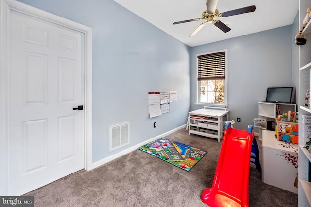 recreation room featuring ceiling fan and carpet flooring