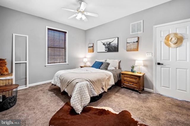 bedroom featuring ceiling fan and carpet