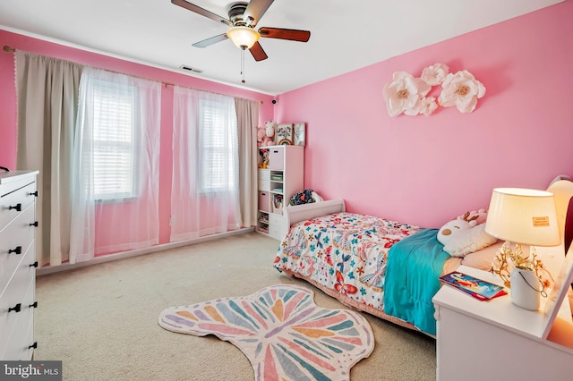 carpeted bedroom with ceiling fan