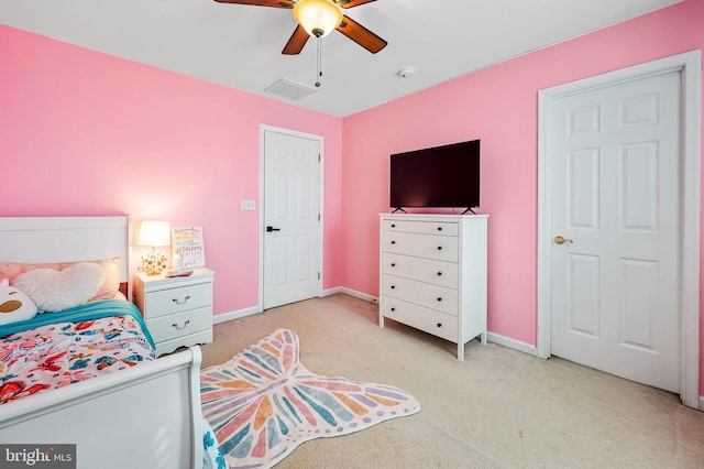 bedroom featuring light colored carpet and ceiling fan