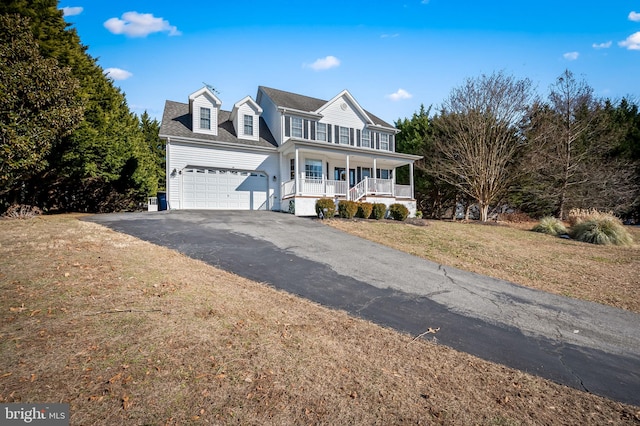 view of front of property with a front yard and covered porch