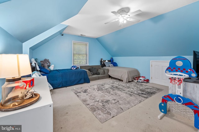 carpeted bedroom featuring lofted ceiling and ceiling fan