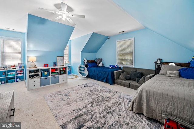 carpeted bedroom featuring lofted ceiling and ceiling fan