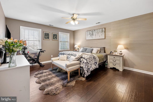 bedroom with ceiling fan and dark hardwood / wood-style flooring