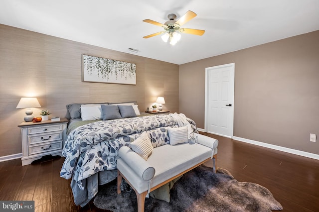 bedroom with dark wood-type flooring and ceiling fan