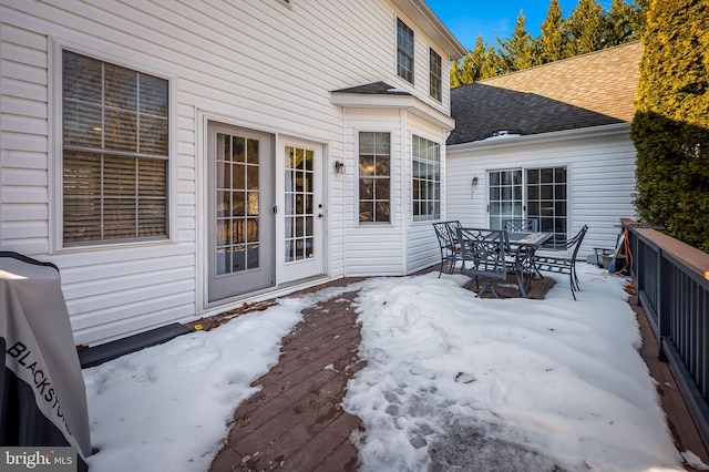 view of snow covered deck