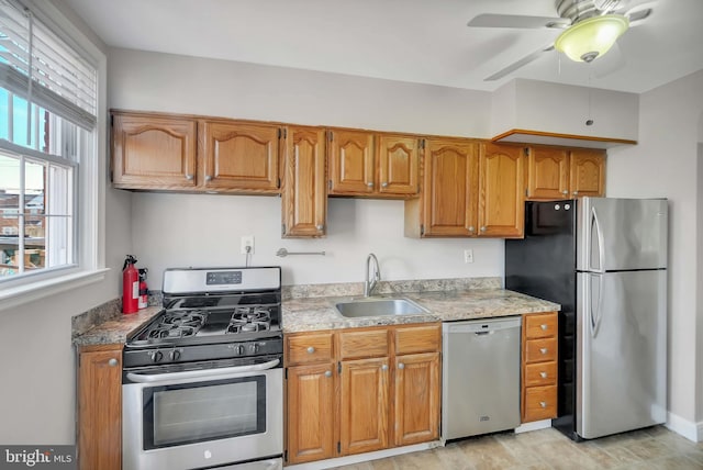 kitchen with ceiling fan, appliances with stainless steel finishes, and sink