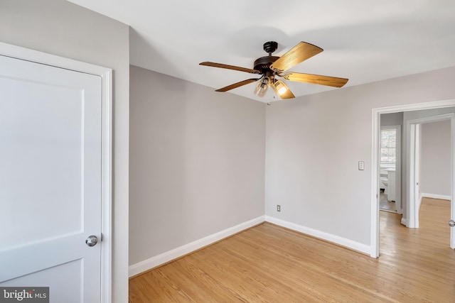 empty room with ceiling fan and light wood-type flooring