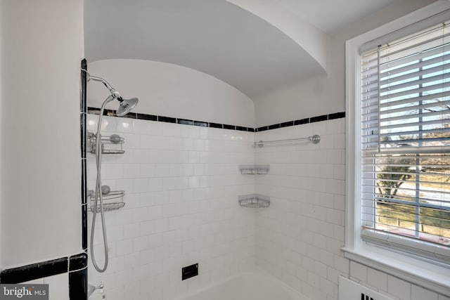 bathroom with lofted ceiling