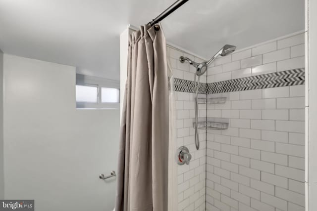 bathroom with a shower with shower curtain