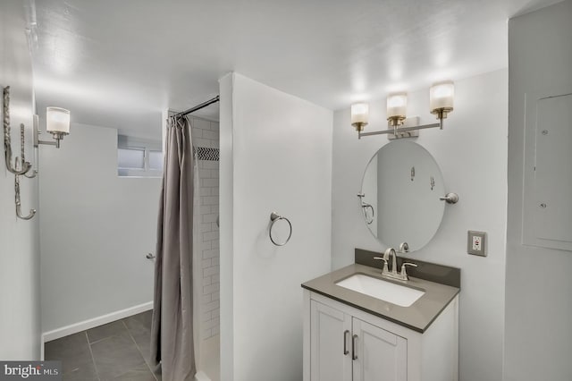 bathroom with vanity, tile patterned flooring, and curtained shower