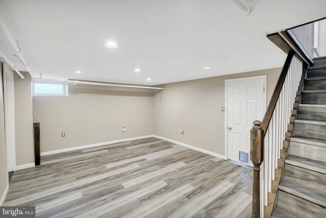 basement featuring light hardwood / wood-style flooring