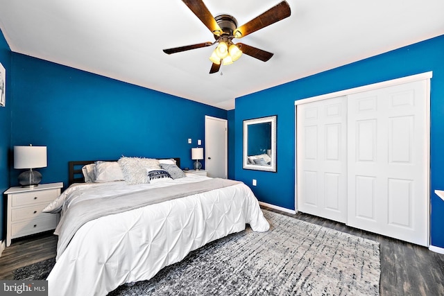 bedroom with ceiling fan, dark hardwood / wood-style floors, and a closet