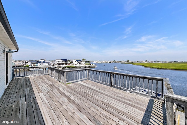 wooden deck with a water view