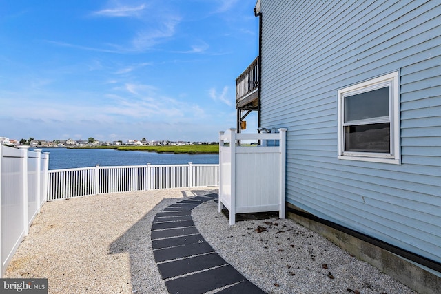 view of patio with a water view