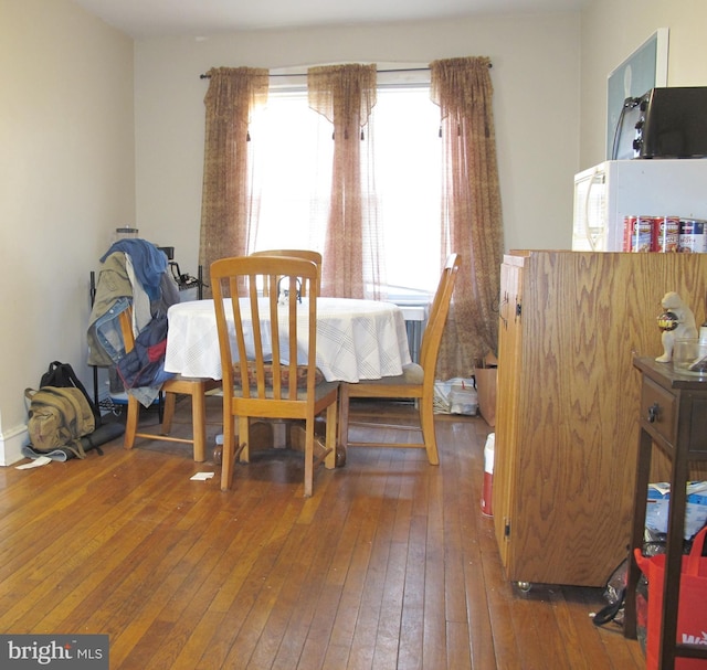 dining room with wood-type flooring