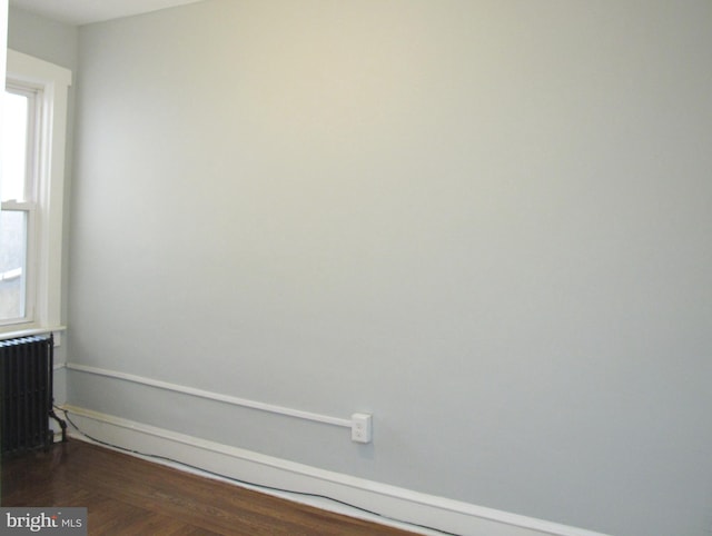 empty room featuring radiator heating unit