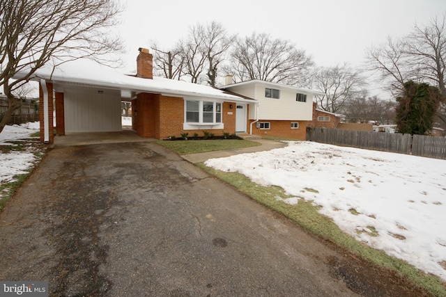 tri-level home featuring a carport