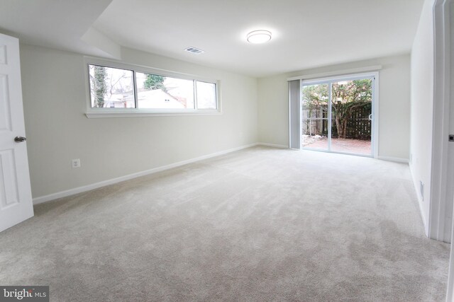 spare room with light colored carpet