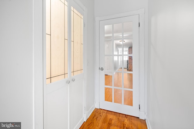 entryway featuring wood finished floors and baseboards