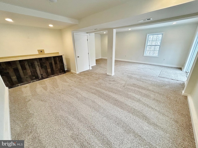 basement with visible vents, recessed lighting, carpet flooring, and baseboards