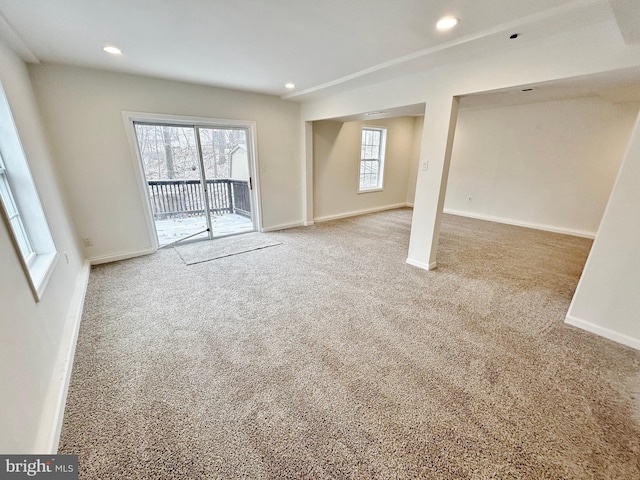 interior space featuring recessed lighting, baseboards, and carpet flooring