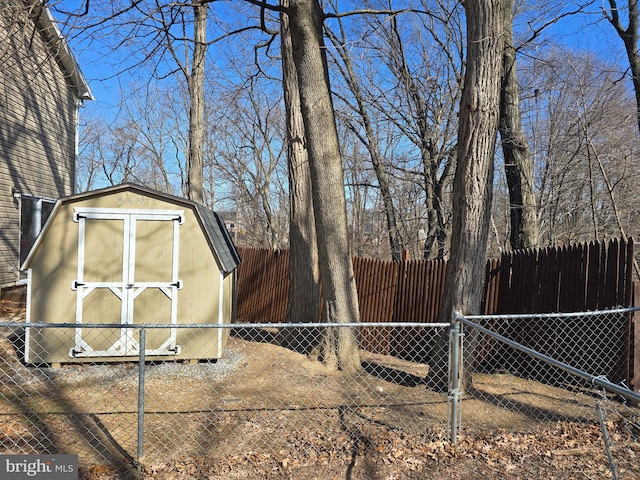 view of yard with a storage shed, fence private yard, and an outdoor structure