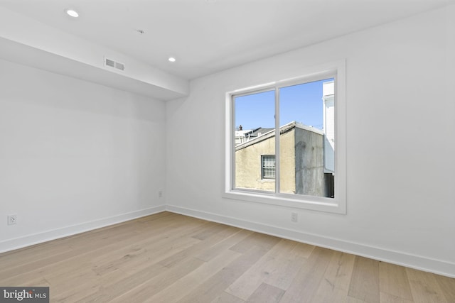 unfurnished room featuring light wood-type flooring