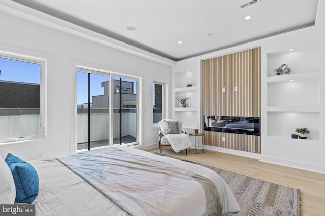 bedroom featuring light hardwood / wood-style flooring and access to exterior