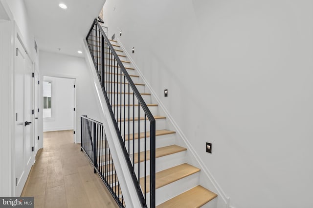 stairway featuring hardwood / wood-style flooring