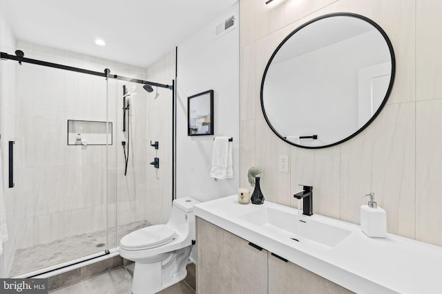 bathroom featuring toilet, walk in shower, and vanity