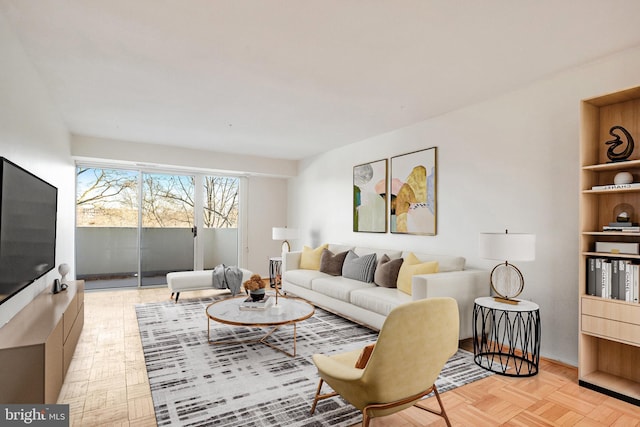 living room featuring light parquet floors