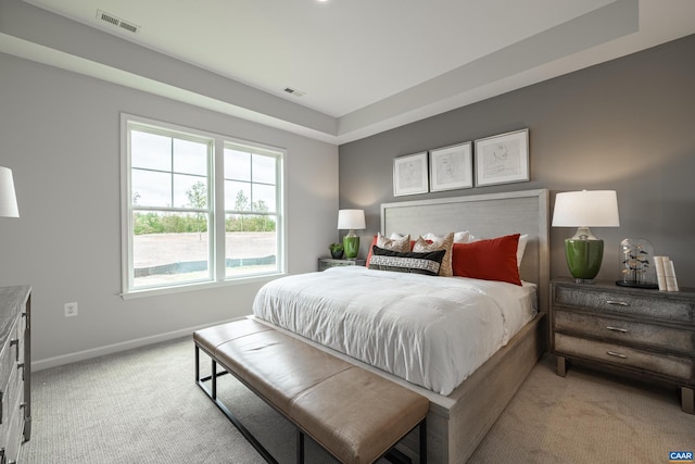 bedroom featuring light colored carpet