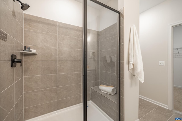 bathroom featuring tile patterned flooring and walk in shower