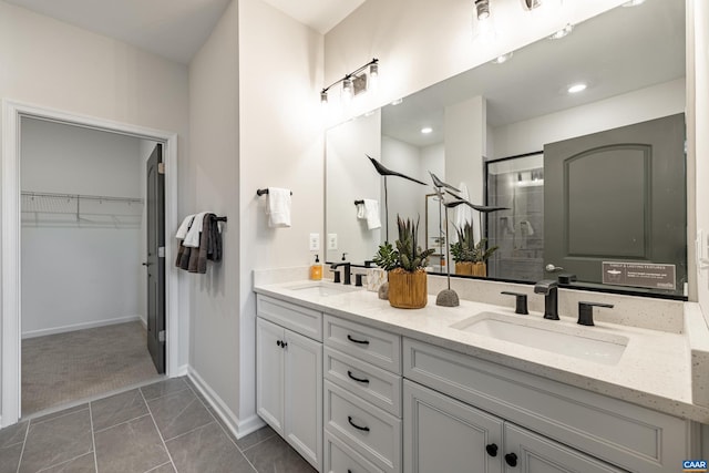 bathroom with vanity, tile patterned flooring, and a shower with shower door