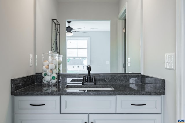 bathroom with ceiling fan and vanity