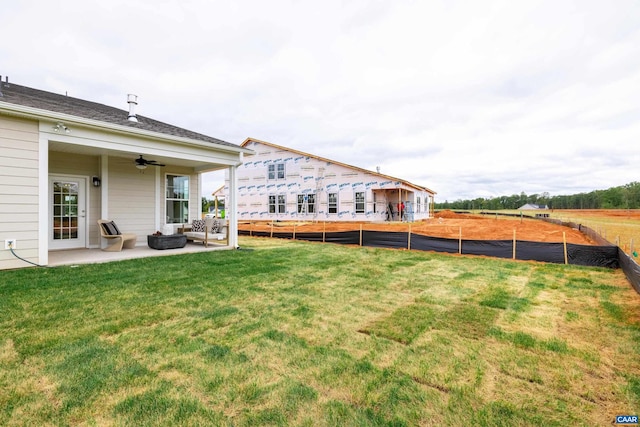 view of yard with a patio area and ceiling fan