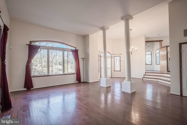 interior space featuring dark hardwood / wood-style floors and a notable chandelier