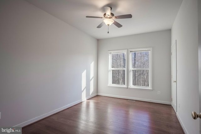 unfurnished room featuring ceiling fan and hardwood / wood-style flooring