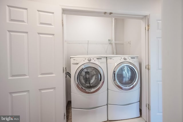 laundry area with washing machine and dryer