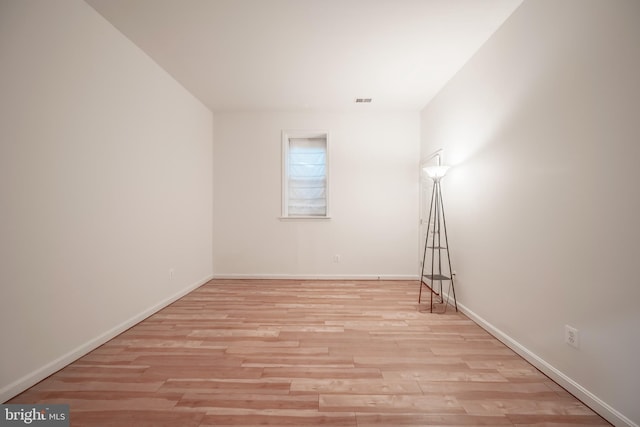 unfurnished room featuring light hardwood / wood-style floors