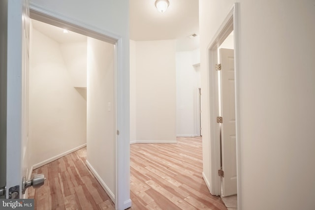 corridor featuring light hardwood / wood-style flooring